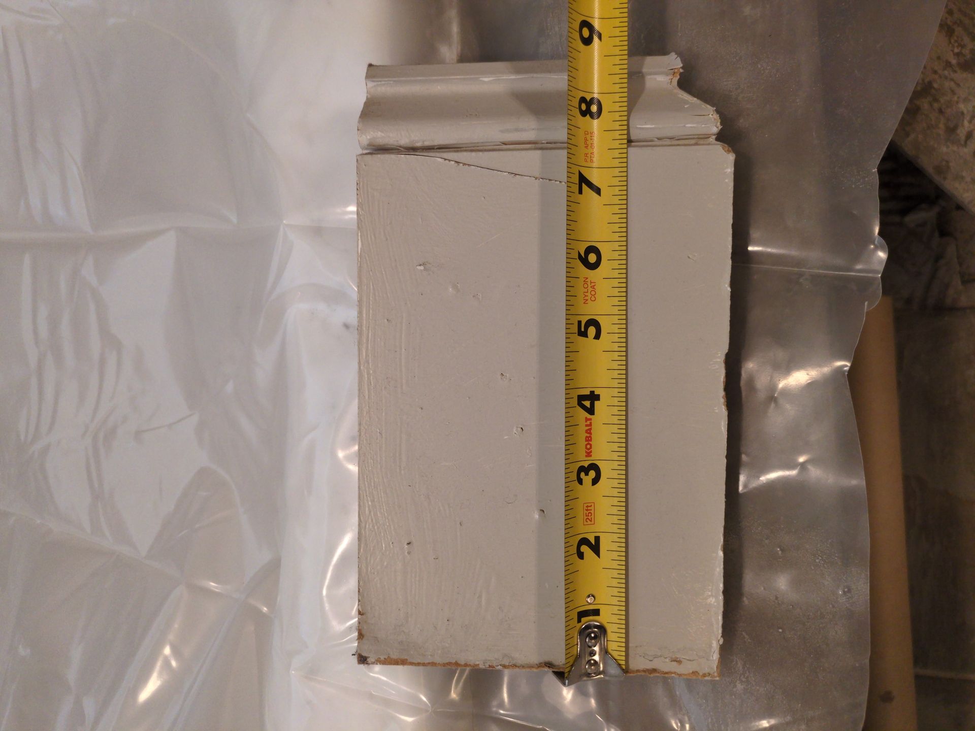 Unboxing new grey ceramic floor tiles for an Athens bathroom remodel